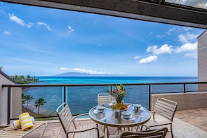 Enjoy a meal or a glass of wine on your private oceanfront lanai
