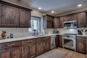 Cooks will love the fully remodeled kitchen with commercial-grade range