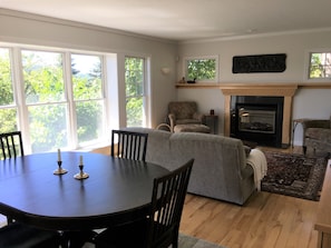 Great room - living and dining areas with full wall of south-facing windows