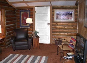 Log living room with new flat screen HD TV
