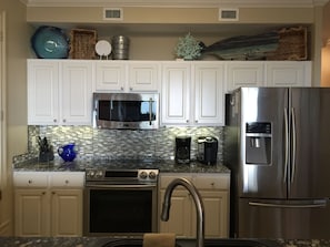 Stainless appliances, granite and mosaic tile 