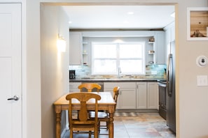 Kitchen with table that seats 4.