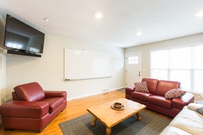 Front door into bright and spacious and business friendly living room.