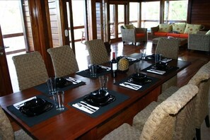 Great room on the main floor with dining space, living space and open kitchen
