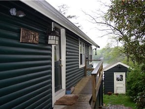 Main entrance and view of boathouse