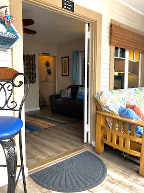 Cozy SunPorch at the front of the house! Large windows open for ocean view
