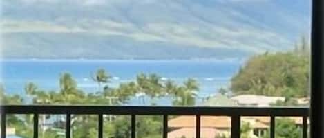 Wrought iron patio furniture overlooking the ocean and West Maui Mountains
