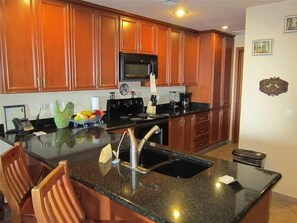 Full kitchen, laundry room just beyond kitchen