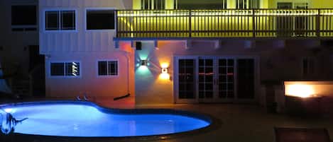 Pool, Patio and Fire Pit at Night 