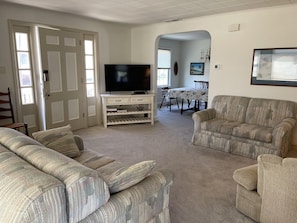 Open living room area that connects to the dining room.