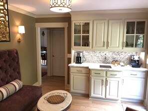 Kitchen sitting area with coffee and espresso bar.