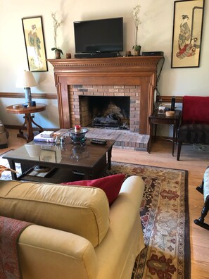 Comfortable gathering room with gas fireplace and flatscreen tv. 