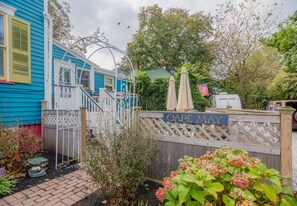 Enclosed patio with BBQ,  ample seating and deck