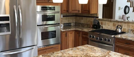 Kitchen is loaded with 2 ovens, microwave, & gas range.  Also, fully stocked.