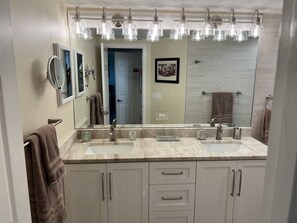 Primary Bathroom: Two Sinks , Lighted Magnifying Vanity Mirror 