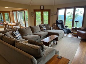 Comfortable seating in an open floor plan with natural light and great views 