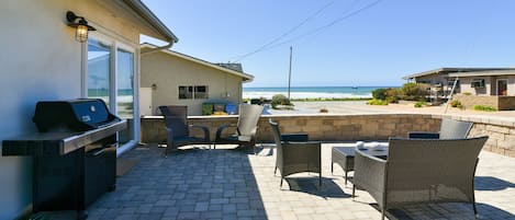 Enjoy sitting on this beautiful front patio furniture listening to the surf