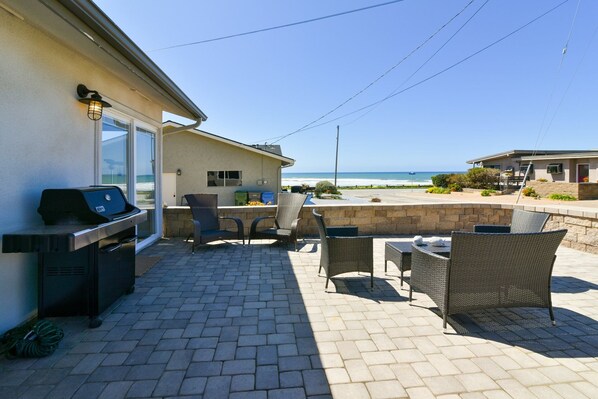 Enjoy sitting on this beautiful front patio furniture listening to the surf