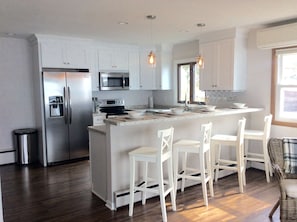 Open Concept Kitchen Overlooks Living Room