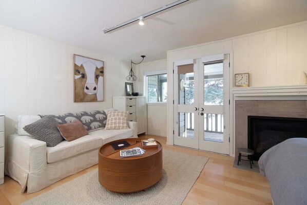 Studio living area with cozy gas fireplace
