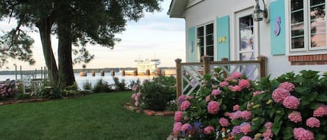 Cottage entry with river in background .just a few steps from the waterside deck