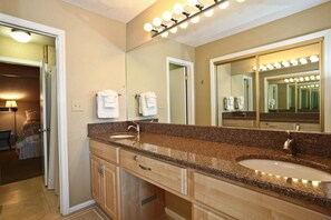 Master bath has comfort height, granite twin vanity