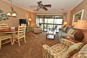 Living room has lots of seating, HDTV