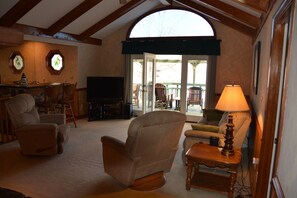 Living Room with Wet Bar, Dish TV, and Access to Upper Porch