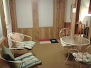 Upstairs Unit- Front entrance/sunroom with additional table & chairs
