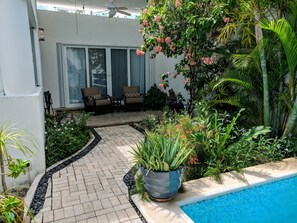 Private sitting area to relax and enjoy the pool's waterfall in the morning.