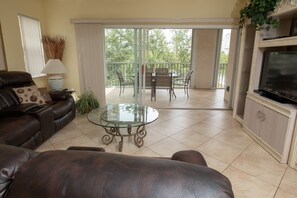 Living room with sliding doors leading to the lanai.