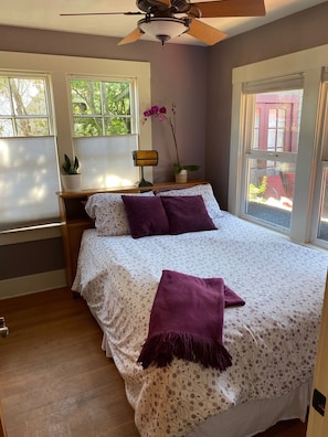 Queen Bed 2 with built in desk overlooking deck, fruit trees and garden