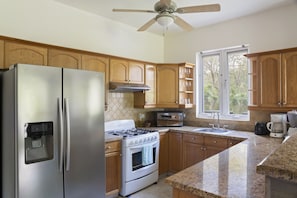 Full kitchen - Stainless appliances, coffee maker, microwave, blender, toaster.