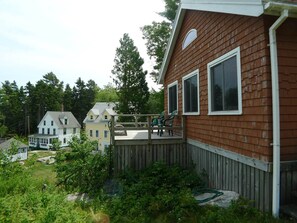 Cottage sits on top of a hill. Those two house down the hill use to be one hotel
