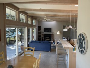 Living room and bar with fireplace and flat screen TV