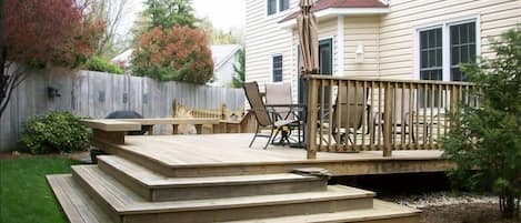 Backyard Deck with fenced yard.  Outdoor dining table seats 6.