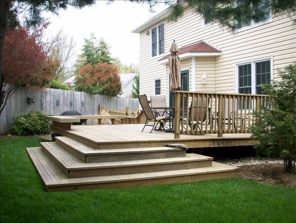 Backyard Deck with fenced yard.  Outdoor dining table seats 6.