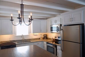 Fully outfitted kitchen with dishwasher, microwave, stove, and much more