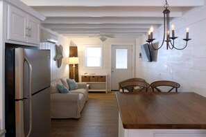 Open floor plan kitchen and living room with island seating in between