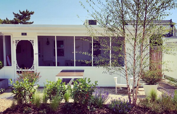 Classic beach cottage with screened front porch and 