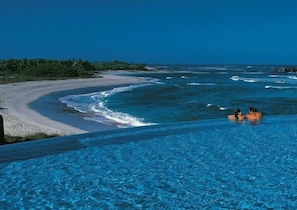 Infinity pool overlooking  Four Season's exclusive white sand beach.