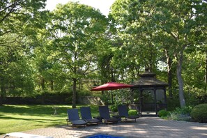 Gazebo and outside shed housing bikes and pool toys
