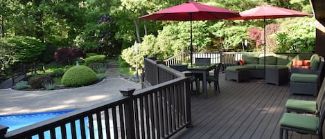 Waterfall and dual ponds adjacent to deck and pool.
