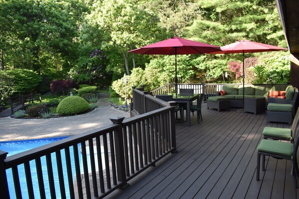 Waterfall and dual ponds adjacent to deck and pool.
