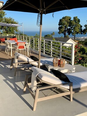Sweeping ocean views from the deck, living and dining rooms