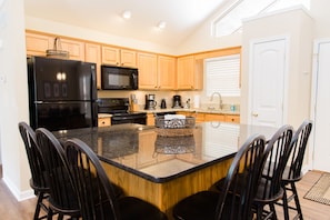 Large stocked kitchen with plenty of pantry and counter space.