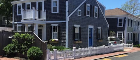 Commercial street view with new picket fence