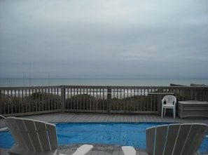 View from pool deck out to the beach.