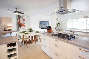 Gas Range, Quartz Counters, Wine Racks, Ample Self-Closing Drawers, Cabinets