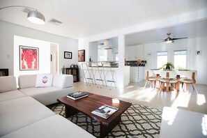 Abundant seating in an open room with 66' flat screen TV and surround sound. 
